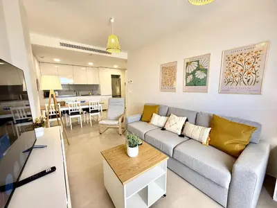 a living room with a couch and a table at El rincon de candor by staycare in Rota