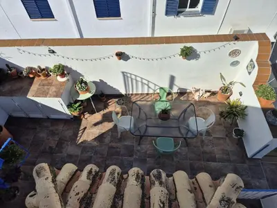 an overhead view of a patio with potted plants at El Patio Grande in Sanlúcar de Barrameda