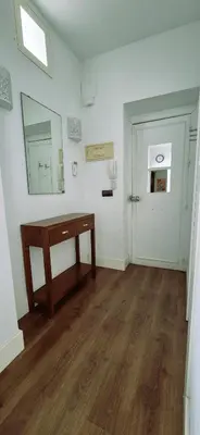 a room with a table and a mirror and a door at Tacita de Plata by Gades Gestion in Cádiz