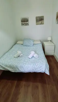 a bedroom with a bed with two towels on it at Tacita de Plata by Gades Gestion in Cádiz