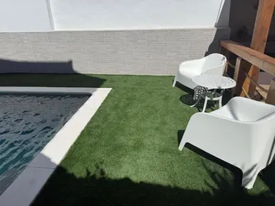 a living room with a staircase and a washing machine at Apto Nº1 LAVANDA y Apto Nº 3 JAZMIN in Chipiona