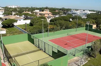 an aerial view of a tennis court in a city at Chalet junto a la playa de La Barrosa in Novo Sancti Petri