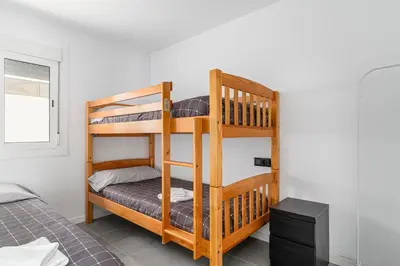 a bunk bed room with two bunk beds at Chiclana Dreamhouse in Chiclana de la Frontera