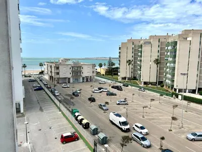 a view of a parking lot with parked cars at GATU Magavi Playa parking piscinas terraza 