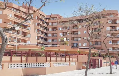 a large apartment building in front of a building at Apto G2 SANLUCAR DE BARRAMEDA in Sanlúcar de Barrameda