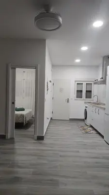 an empty room with a kitchen and a bedroom at Apto G2 SANLUCAR DE BARRAMEDA in Sanlúcar de Barrameda