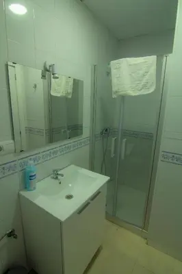 a bathroom with a sink and a shower at Apartamentos Jerez centro in Jerez de la Frontera