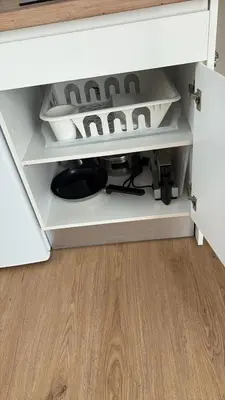 a drawer in a cabinet with a plate in it at El Sueño in Jerez de la Frontera