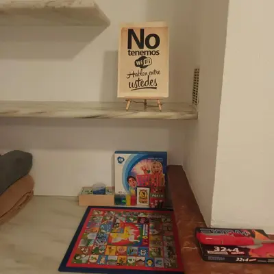 a no termites allowed sign on a shelf with toys at Casa Rural MATEOS in El Puerto de Santa María