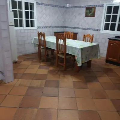 a dining room with a table and chairs in a room at Casa Rural MATEOS in El Puerto de Santa María