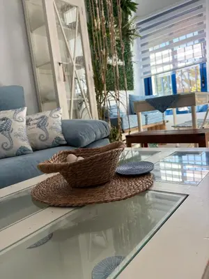 a glass table with a basket on top of it at Mi refugio azul in Cádiz