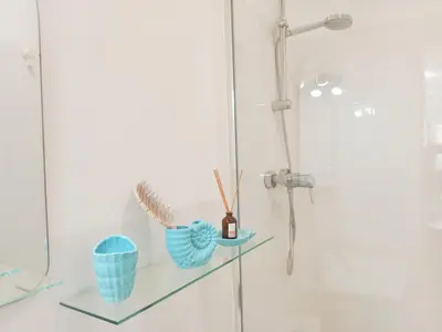 a glass shelf in a bathroom with a shower at Apartamento Fuente de Los Naranjos in Jerez de la Frontera