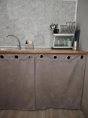 a kitchen with a sink and a counter top at Casa adosada con patio in Jerez