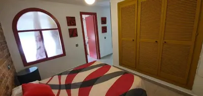 a bedroom with a bed and a window at Amplio apart con Wifi y Aire Acondicionado a 500 m de la playa La Barrosa in Chiclana de la Frontera