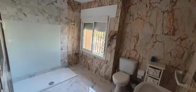 a bathroom with a tub and a toilet and a sink at Amplio apart con Wifi y Aire Acondicionado a 500 m de la playa La Barrosa in Chiclana de la Frontera