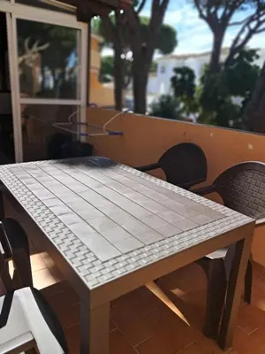 a table and chairs sitting on a patio at La caracola in Novo Sancti Petri