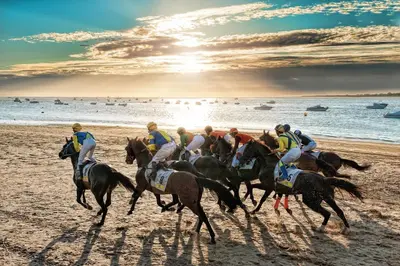 a group of people riding horses on the beach at Casa Lotte, centro histórico,AC, garaje, wifi in Sanlúcar de Barrameda