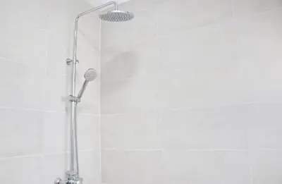 a shower with a shower head in a bathroom at Chalet Ruperto II in Conil de la Frontera