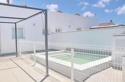 a tennis court on the roof of a building at Chalet Ruperto II in Conil de la Frontera