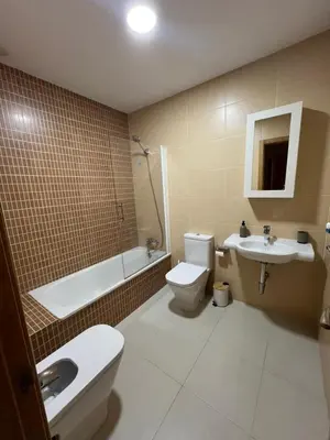 a bathroom with a toilet and a sink and a shower at Apartamento turístico in Chiclana de la Frontera