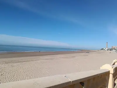 a view of the beach from a fence at Apartamento de lujo en Playa de Regla in Chipiona