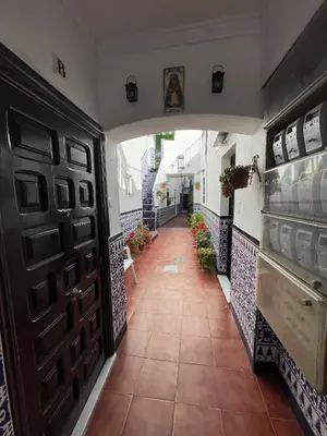 a hallway with two doors and a tile floor at Apartamento el Ancla in El Puerto de Santa María