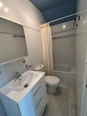 a bathroom with a white sink and a toilet at Chalet adosado en Novo Sancti Petri in Cádiz