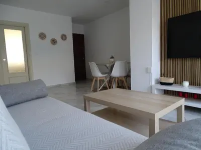 a living room with a couch and a coffee table at Apartamento Capillera 9 in El Puerto de Santa María