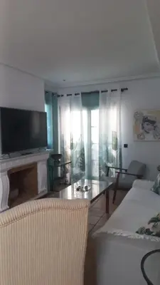 a living room with a couch and a table at Marina Sur in San Fernando