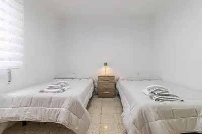 two beds sitting next to each other in a bedroom at Sherry Sunset in Jerez de la Frontera