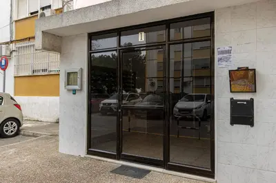 a glass door of a building with cars in it at Sherry Sunset in Jerez de la Frontera
