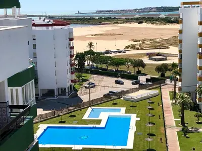 an aerial view of a resort with a pool and the beach at GATU Náutico 