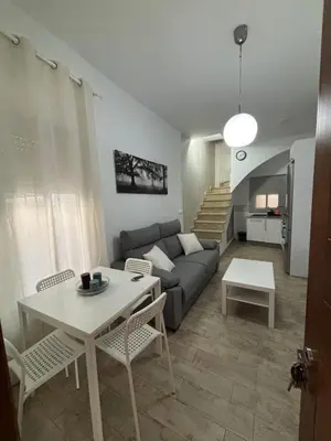 a living room with a couch and a table at Las Manuelas in Arcos de la Frontera
