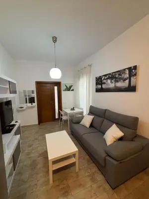 a living room with a couch and a table at Las Manuelas in Arcos de la Frontera