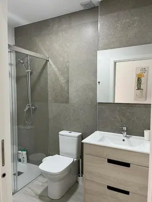 a bathroom with a toilet and a sink and a shower at Austria 05 in Lebrija