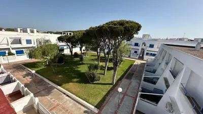 an aerial view of a yard with trees and buildings at Casa doble Almadraba in Novo Sancti Petri