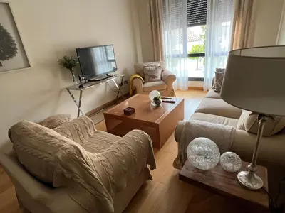 a living room with a couch and a coffee table at Apartamento Jerez in Jerez de la Frontera