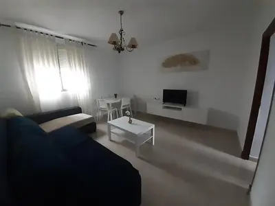 a living room with a couch and a table at Granadina 4 in Jerez de la Frontera