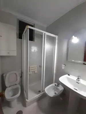 a bathroom with a shower and a toilet and a sink at Granadina 4 in Jerez de la Frontera