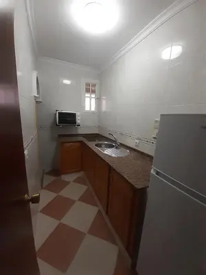 a small kitchen with a sink and a refrigerator at Granadina 4 in Jerez de la Frontera