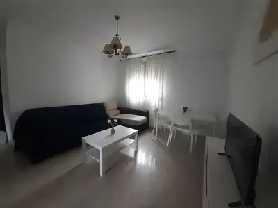 a living room with a couch and a table at Granadina 4 in Jerez de la Frontera