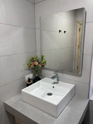 a bathroom with a white sink and a mirror at Casita de Don Juan Tenorio in Torrecera