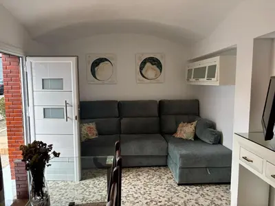 a living room with a couch and a table at Casita de Don Juan Tenorio in Torrecera