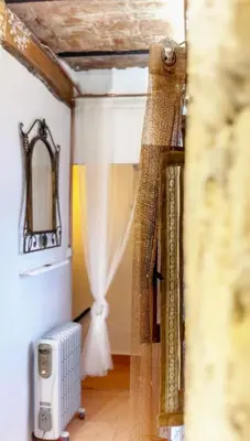 a view of a room with a curtain and a window at Casa arabe in Alcalá de los Gazules