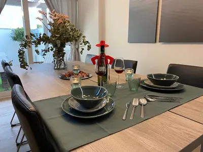 a table with plates and wine glasses on it at Jerez Deluxe in Jerez de la Frontera
