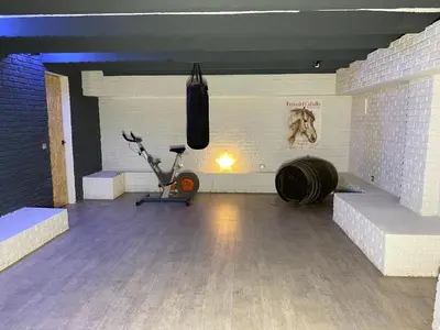 a gym with a punching bag hanging on the wall at Jerez Deluxe in Jerez de la Frontera