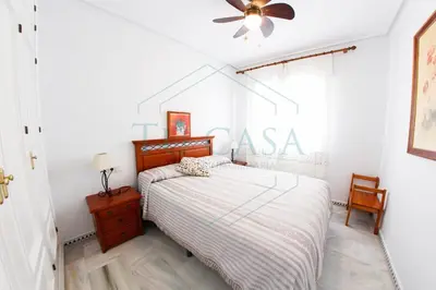 a bedroom with a bed and a ceiling fan at Villa La Marea in Chiclana de la Frontera