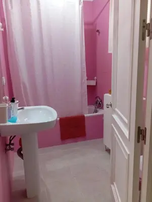 a bathroom with a sink and a bath tub at Apartamento B&A in El Cuervo