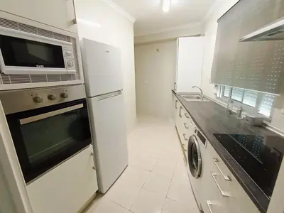 a kitchen with a stainless steel oven and microwave at Apartamento B&A in El Cuervo