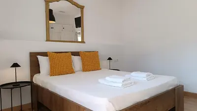 a white bathroom with a sink and a mirror at Sherryflat Prieta 7 in Jerez de la Frontera